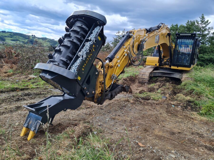 Fixed tooth excavator mulcher on CAT digger