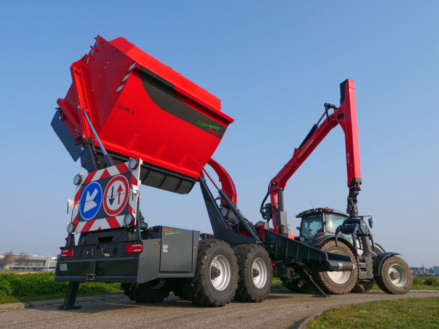 Chipper with high lift bin